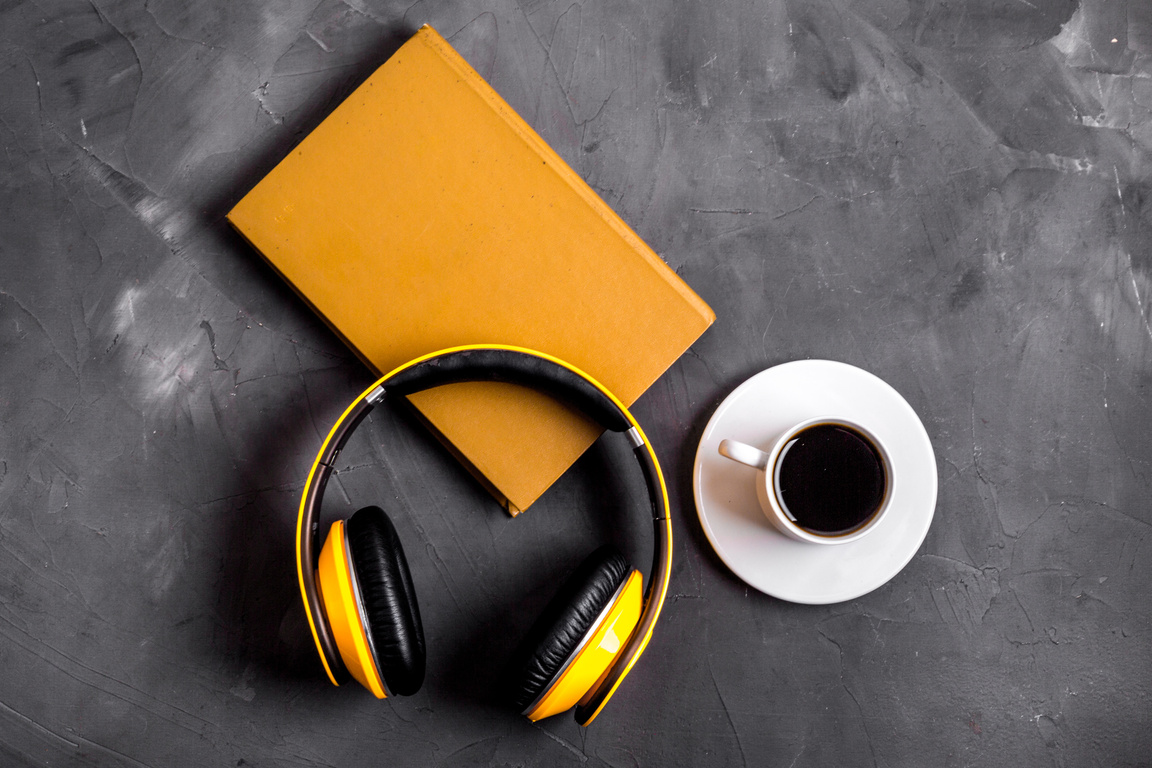 Audio book concept with headphones top view